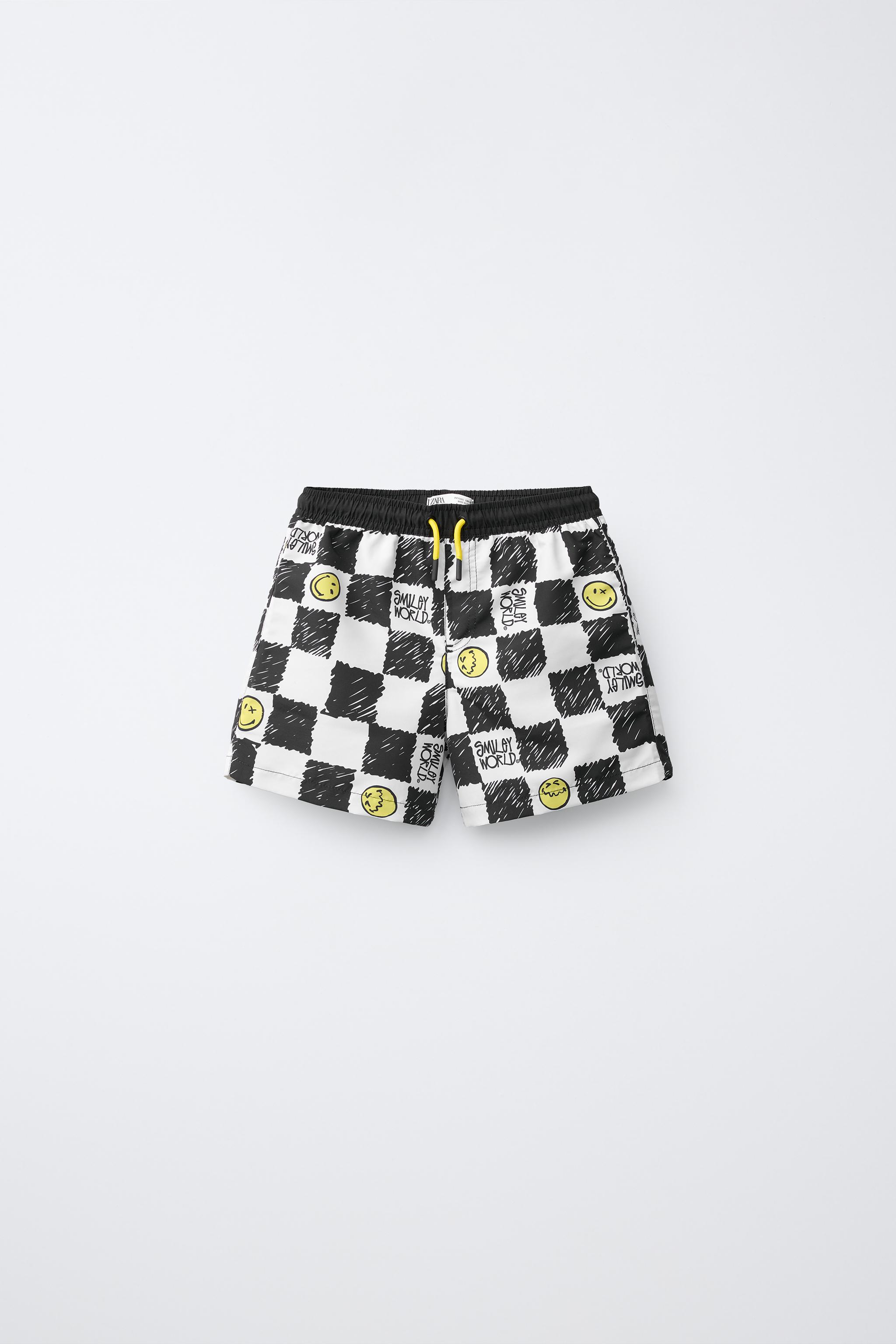 6-14 ANS/ SHORT DE BAIN DAMIER SMILEYWORLD ®
